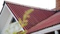 Corrugated roofing roof. Stock footage. Details of red roof made and covered from metal profile. Close-up of roof Royalty Free Stock Photo