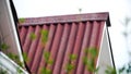Corrugated roofing roof. Stock footage. Details of red roof made and covered from metal profile. Close-up of roof Royalty Free Stock Photo