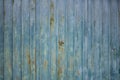 Corrugated rusty metal garage doors texture with lock in center