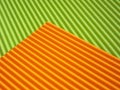 The corrugated surface is multicolored with parallel lines as a background black blue orange crimson pink light green