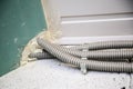 Corrugation for electrical wiring attached to the wall. Electrical installation system in new home construction Royalty Free Stock Photo