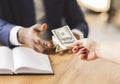 Corrupted businessman making black deal, taking bribe money from partner Royalty Free Stock Photo