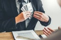 Corruption concept,Business man passing money dollar bills corruption bribery to businessman manager Royalty Free Stock Photo