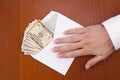 Corruption concept. Business man take a stack of money in envelope. Royalty Free Stock Photo