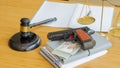 Corruption concept Corrupt by placing guns and dollar bills, hammers and scales on the table. political idea