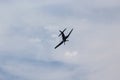 Corsair Airplane Flying through the air with Grey Clouds in the Background