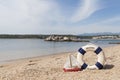 Corsica beach landscape with life buoy and boat Royalty Free Stock Photo