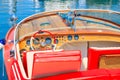 CALVI PORT, CORSICA ISLAND - JUN 28, 2015: stylish retro motor boat mooring in Calvi marina on western coast of Corsica island, Royalty Free Stock Photo