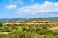 Holiday houses on green hillsTypical Corsican villa houses on green hill in rural landscape of Corsica island, France