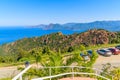CORSICA ISLAND, FRANCE - JUN 27, 2015: cars parked along a road from Piana to Porto near Calanches de Piana which is a nature
