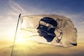 Corsica region of France flag textile cloth fabric waving on the top sunrise mist fog