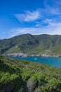 Corsica, seascape in the cap Corse, a creek with a boat