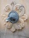 Corsican traditional fountain with drinking water in the stone wall Royalty Free Stock Photo