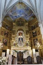 Vertical view. Ornate main altar of Divino Salvador church in the Andalusian magical town of Cortegana, Huelva, Spain