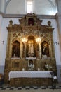 Vertical view. Ornate side altar of Divino Salvador church in the Andalusian magical town of Cortegana, Huelva, Spain