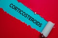 Corticosteroids Text written in torn paper. Medical concept