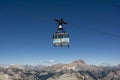 Cortina d`Ampezzo, Dolomites, Italy - July, 8, 2022 : Cable car or Gondola lift ascending from Cortina d`Ampezzo to Tofana di