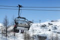 Cortina d`Ampezzo, February 2007: Skiers on the chairlift near Falzarego Pass. Veneto, Italy