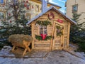 CORTINA D`AMPEZZO, ITALY - DECEMBER 29, 2022: View of pretty elf house in the main square of Cortina d`Ampezzo during christmas ti Royalty Free Stock Photo