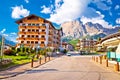 Cortina D` Ampezzo street and Alps peaks view