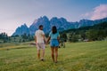 Cortina d'Ampezzo town panoramic view with alpine green landscape and massive Dolomites Alps in the background. Province Royalty Free Stock Photo