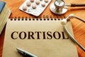 Cortisol hormone on the sheet with stethoscope