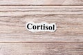 Cortisol of the word on paper. concept. Words of cortisol on a wooden background