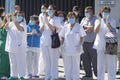 A Coruna-Spain.Healthcare workers dealing with the new coronavirus crisis applaud in return as they are cheered on by Civil Guard