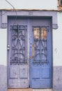 A Coruna, Spain - 02.16.2020: old deteriorated blue wooden door