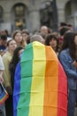 Coruna-Spain. Older person with the LGBT flag on his back during the gay pride demonstration