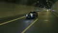 Corvette overtakes and passes by the camera in the night