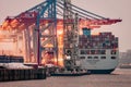 Cosco Container ship at Container Terminal Tollerort in Hamburg Harbor in Germany.
