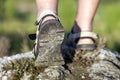 Coseup of sport shoes on trail walking in mountains, outdoors ac