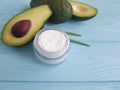 Cosmetic avocado cream on wooden