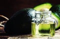 Cosmetic avocado oil in a glass jar, selective focus