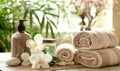 Cosmetic beauty products: aromatic salts, lotion, towels, flowers and stones. Spa salon background