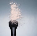 Cosmetic beige powder on black brush scatter make up beauty texture blue Royalty Free Stock Photo