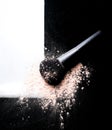 cosmetic beige powder on black brush scatter make up beauty texture Royalty Free Stock Photo