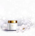 Cosmetic bottle for natural cream. White jar and gold glossy lid with white beautiful Magnolias on the light gray