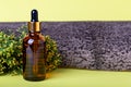 Cosmetic bottle, plant and tree bark close up