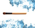 Cosmetic brush on crushed make up blue eye shadow. Royalty Free Stock Photo