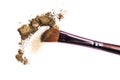 Cosmetic brush and crushed mixed color eyeshadow Royalty Free Stock Photo