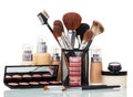 Cosmetic brushes, liquid foundation, lip gloss, blush, cream bank isolated. Royalty Free Stock Photo