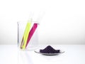 Cosmetic chemicals ingredient on white laboratory table. KMnO4 on chemical watch glass. Potassium Permanganate Liquid and Nickle Royalty Free Stock Photo