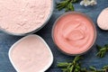 Cosmetic clay. Pink cosmetic clay in different types on a blue wooden table. face mask and body. care products. spa. top view Royalty Free Stock Photo