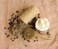 Cosmetic concept with towel, brush soap scrub, coffee beans, flower Royalty Free Stock Photo