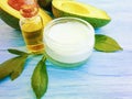 Cosmetic cream, bottle oil, vitamin product organic avocado health on a wooden background Royalty Free Stock Photo