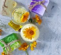 Cosmetic cream essential , freshness relaxation calendula flower soap on concrete background Royalty Free Stock Photo