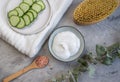 Cosmetic cream, face mask, scrub, cucumber, white bath towel Royalty Free Stock Photo