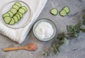 Cosmetic cream, face mask, scrub, cucumber, white bath towel Royalty Free Stock Photo